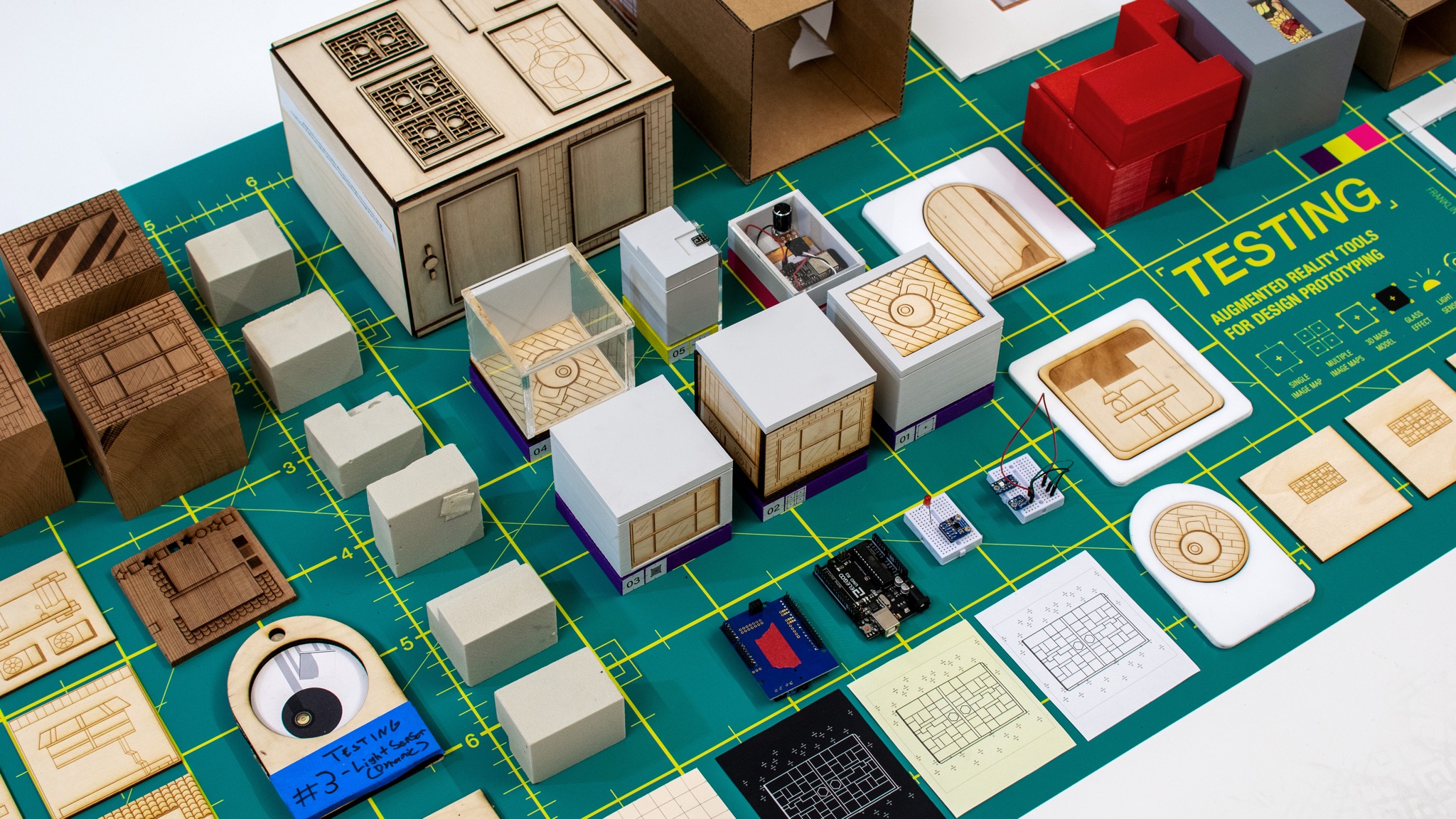 All six prototyping tools laid out on cutting mat with all components